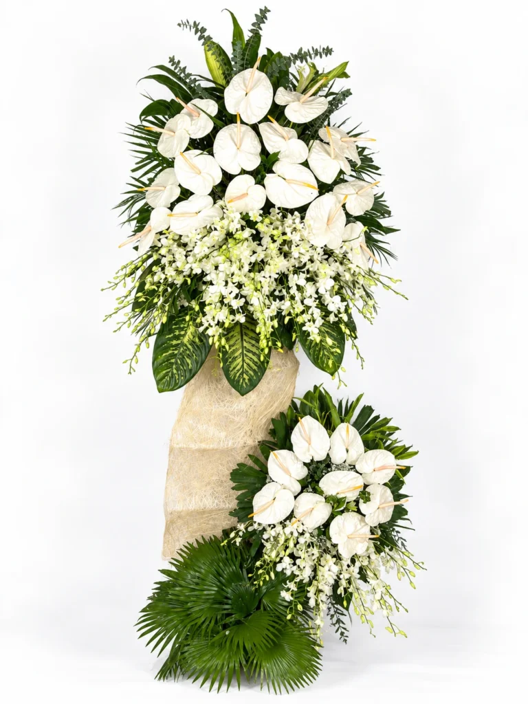 White funeral standing spray on a stand