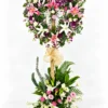 Beloved pink lily funeral heart stand with white lilies, carnations, orchids and a flower base